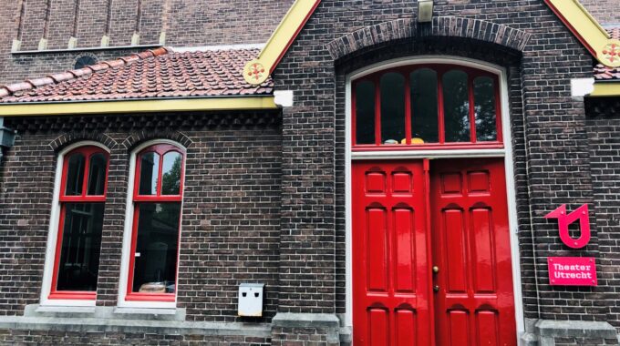 Books and a cup of coffee on a table at a literary salon